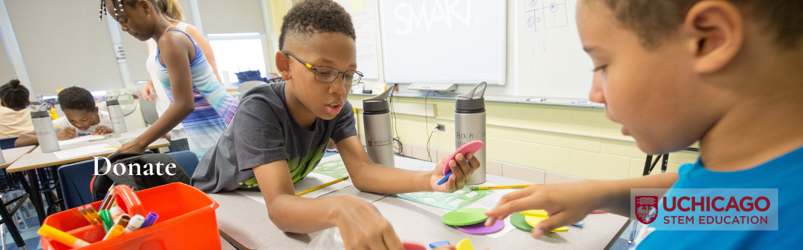 Two boys work with shapes during STEM camp 